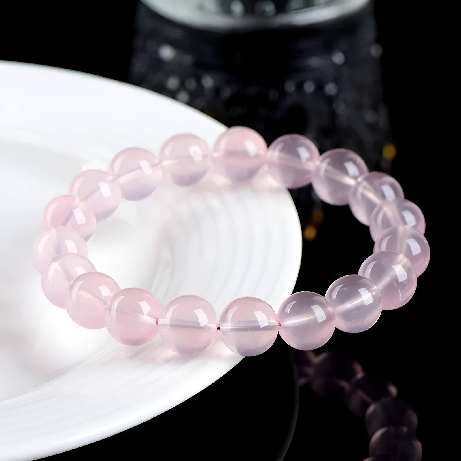 Polished natural crystal bracelet with round beads in pink colour, available in multiple bead diameters
