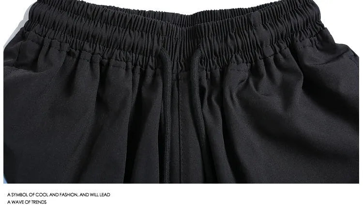 Men's black quick-drying sports shorts with elastic waistband and straight-leg fit for training