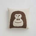 Cartoon anime knitted velvet pillowcase in black big face design on a bed