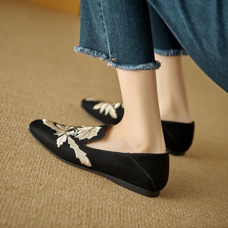Women's beige retro flat pumps with embroidery detail, round toe, and a low-cut design on a soft bottom.