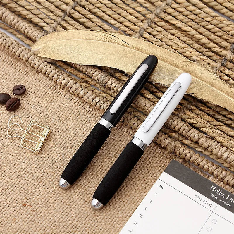 Metal ballpoint pen with bullet tip shown alongside seven refill colour options