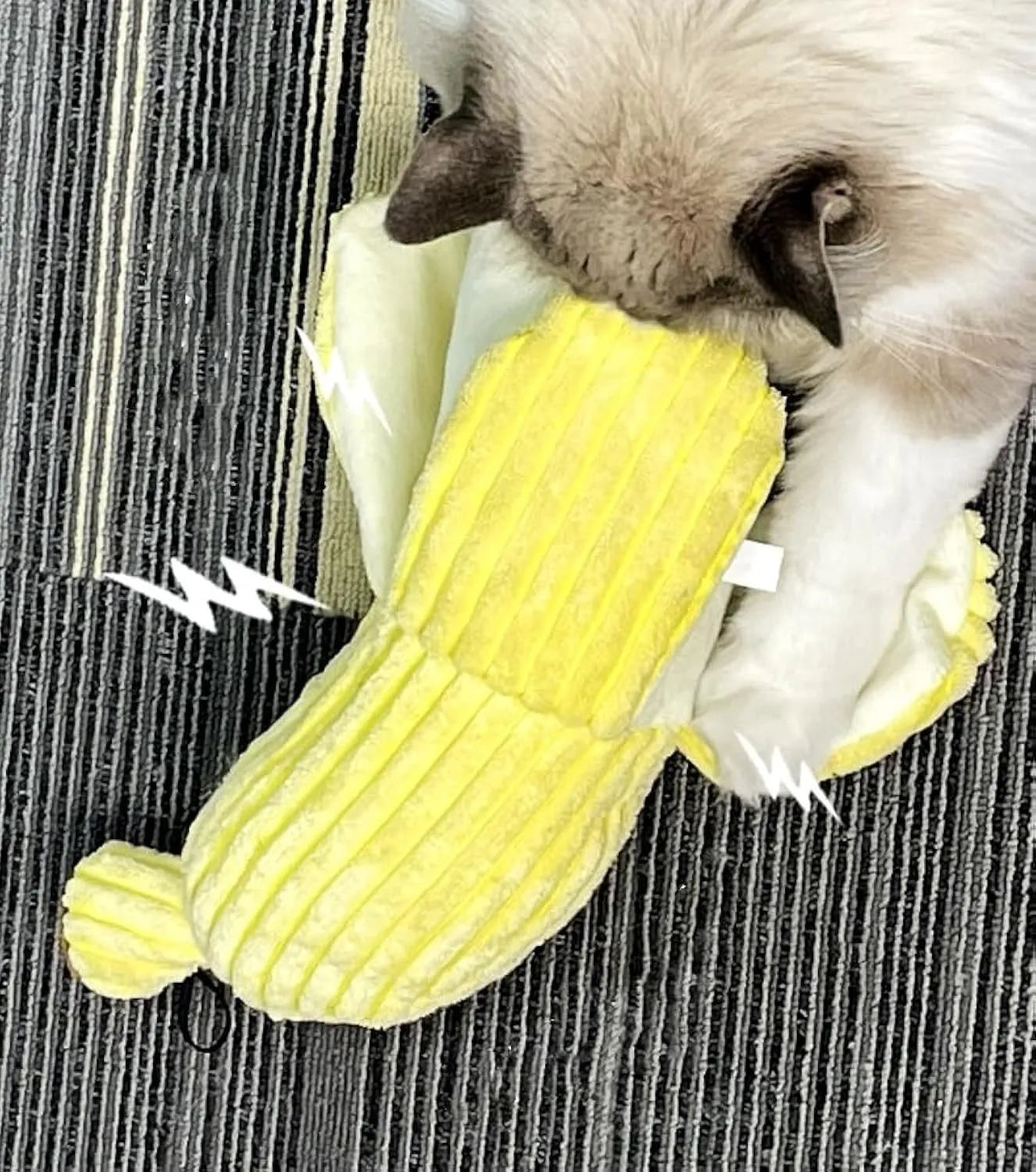 Yellow banana-shaped cat toy with crinkle paper and plush fabric for chewing and kicking