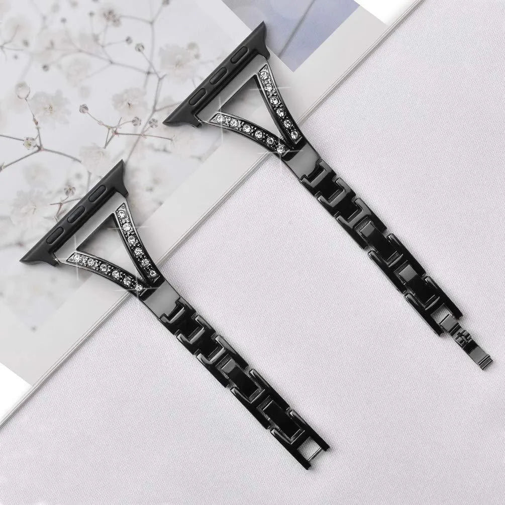 Silver herringbone diamond pattern metal band for Apple Watch on a wrist, showing adjustable links.