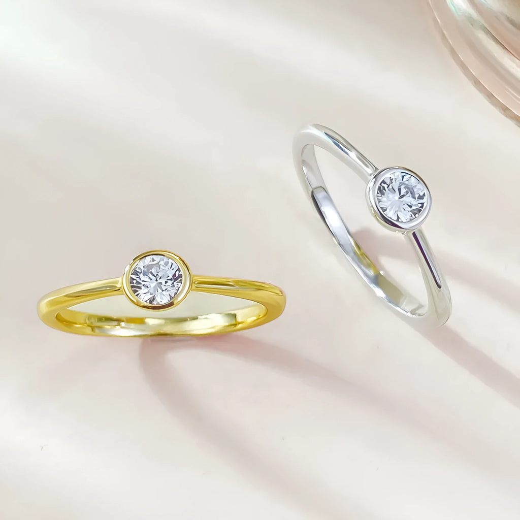 Minimalist silver crown-shaped ring with linear detailing in platinum or gold finish