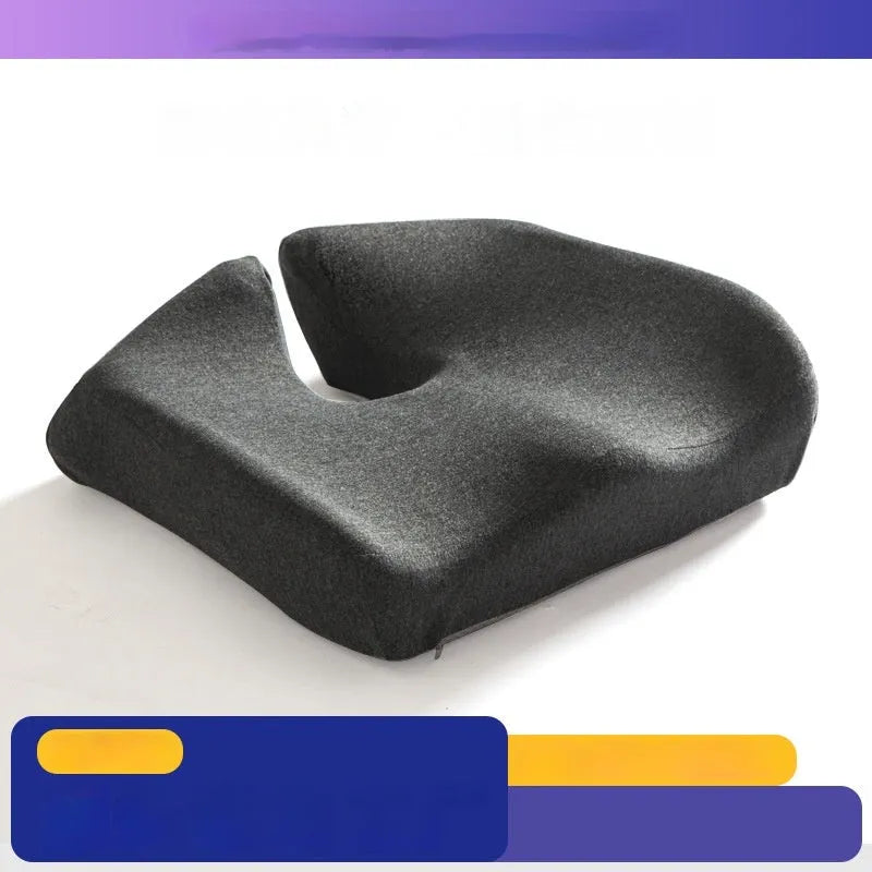 Memory foam office chair cushion with removable mesh cover in grey, shown on a desk chair.