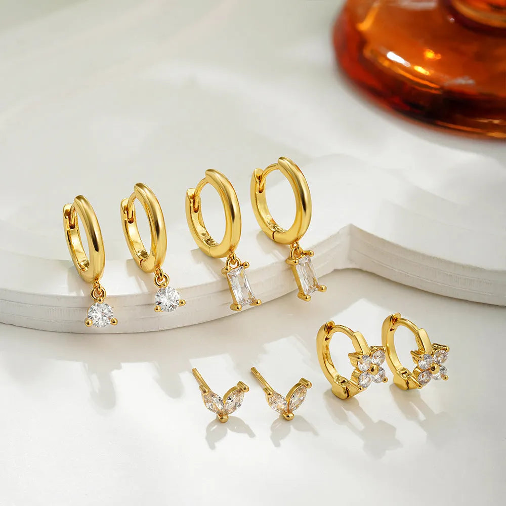 Geometric zircon earrings set for women with gold electroplated finish showing star and square designs