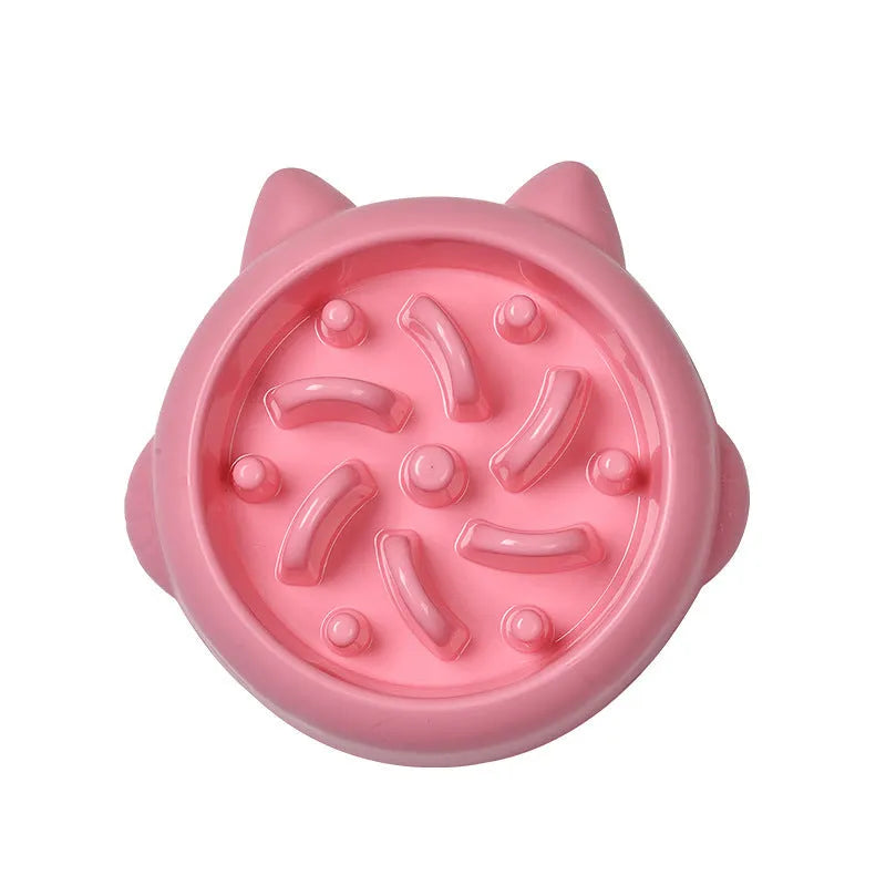 Bone-shaped slow feeder dog bowl with maze pattern in green, pink, or orange colours