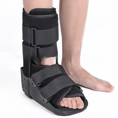 Grey and black Achilles tendon rehabilitation boot with plastic shell, adjustable straps, and rubber sole.