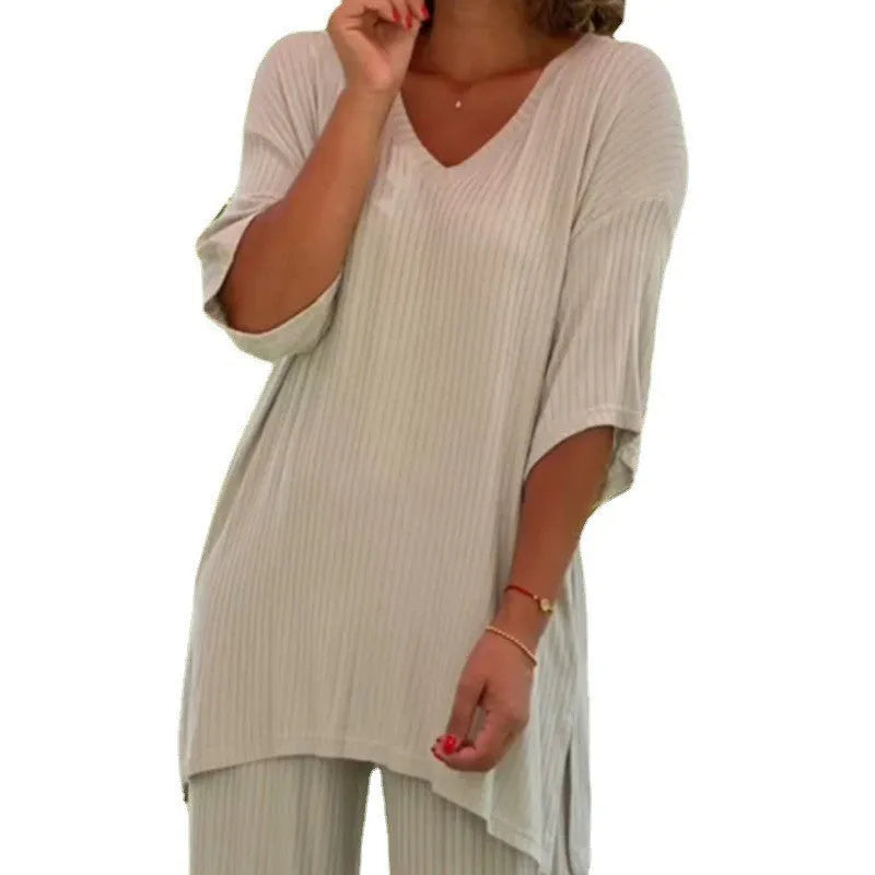 Women's two-piece knitwear set with long sleeve top and baggy straight trousers in black, grey, or beige, sizes S to 3XL