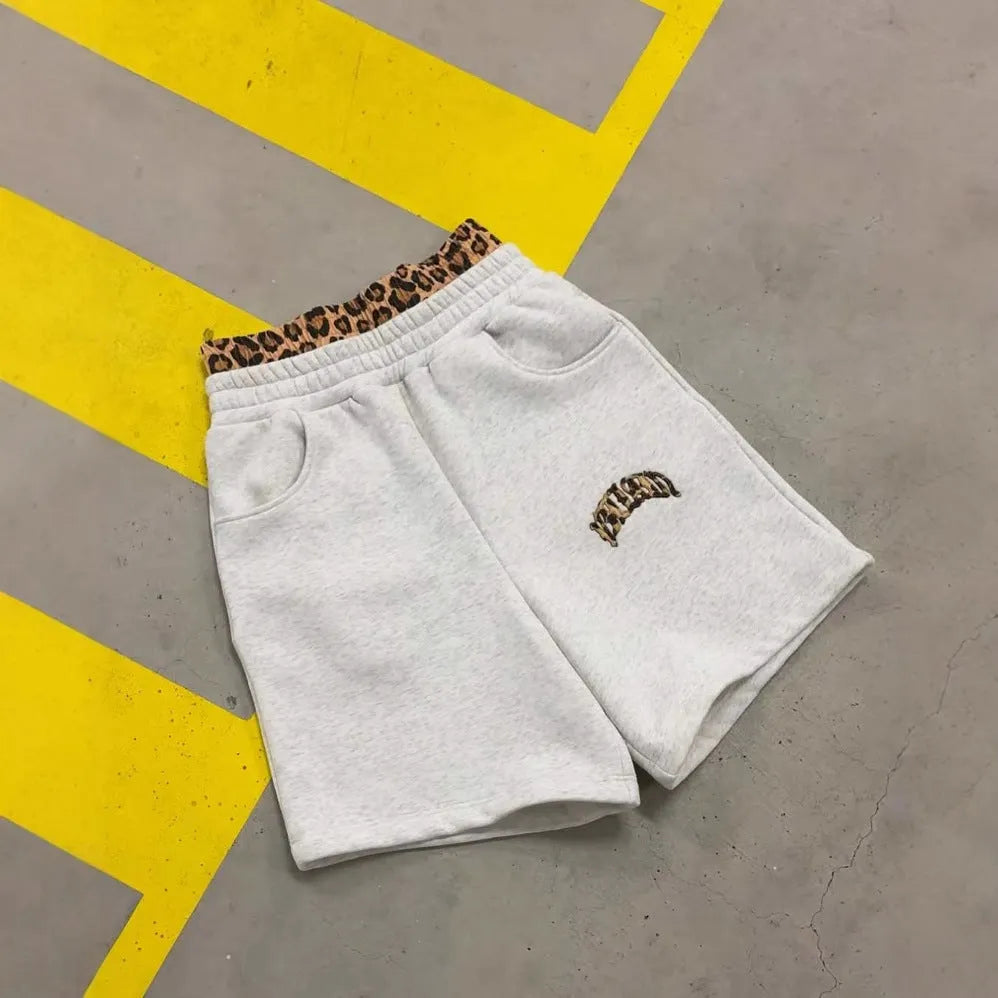 Men's loose patchwork double waist trousers in hip hop style with elastic fabric.