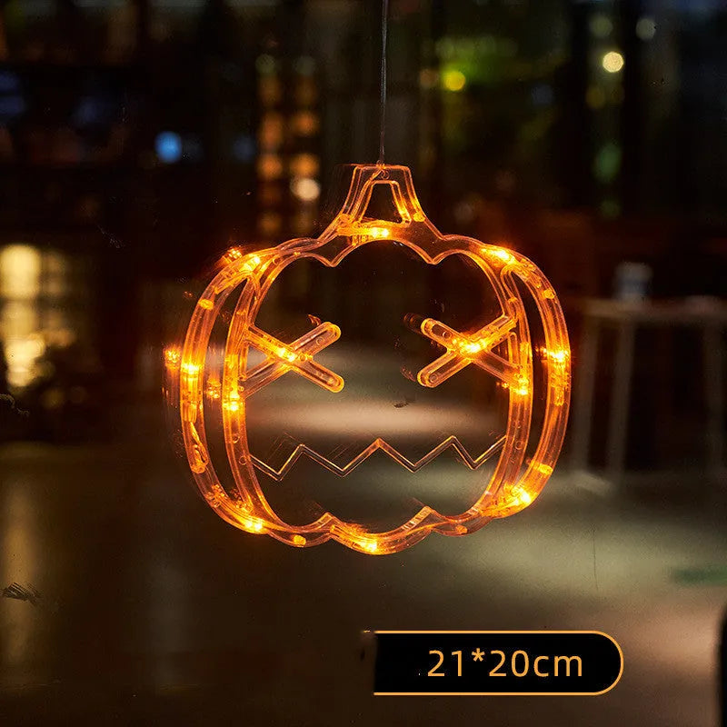 Halloween LED hanging lights with spider, pumpkin and ghost designs featuring suction cups for window mounting