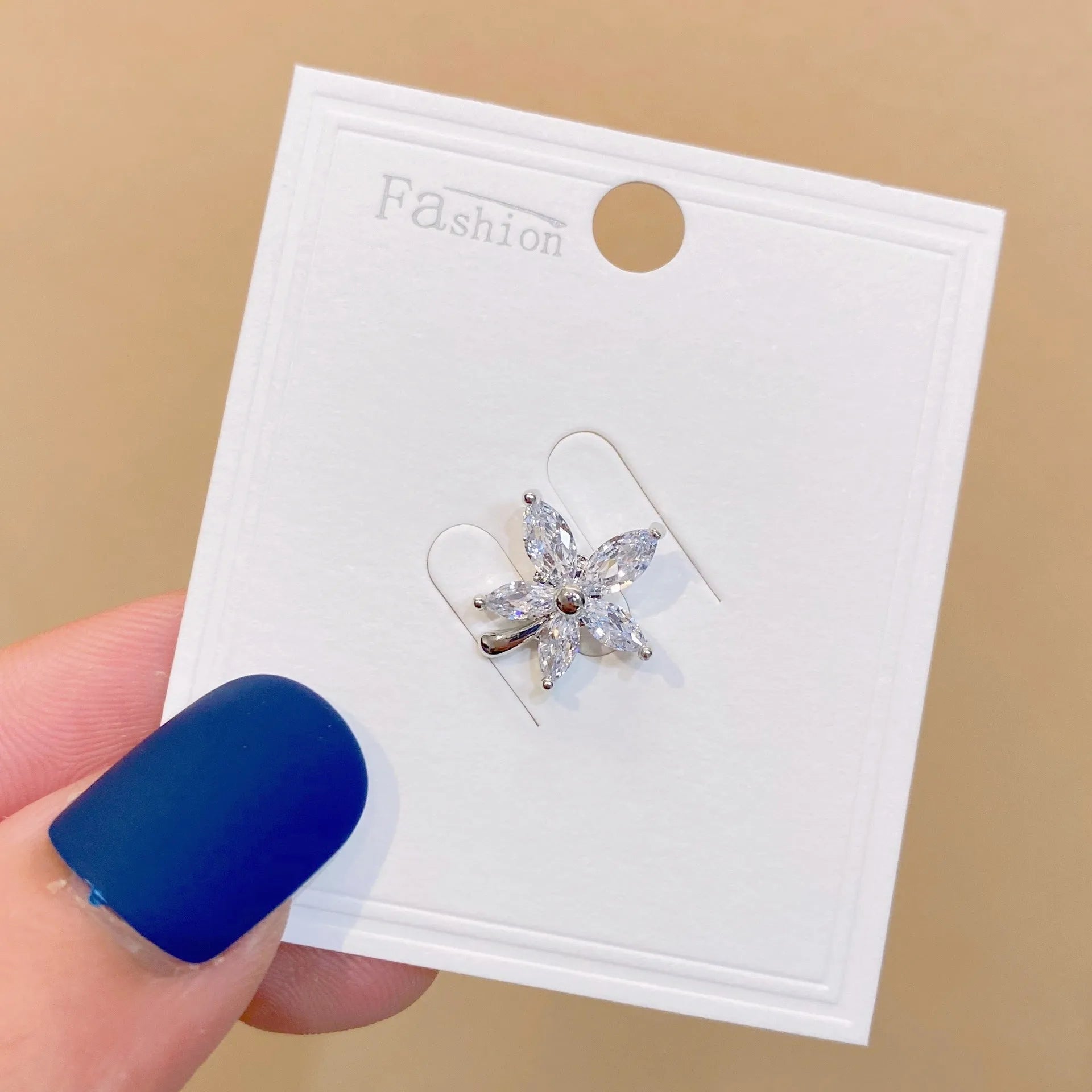 Geometric copper brooch with electroplated finish in Japanese style, showing colour options