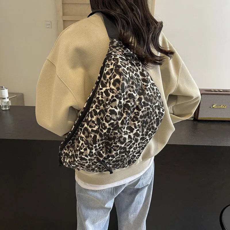 Retro leopard print canvas chest bag with patchwork, soft body, and internal phone pocket for daily matching.