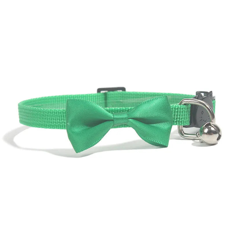 Adjustable nylon cat bow collar with a bell in a striped pattern, shown in a bright colour.