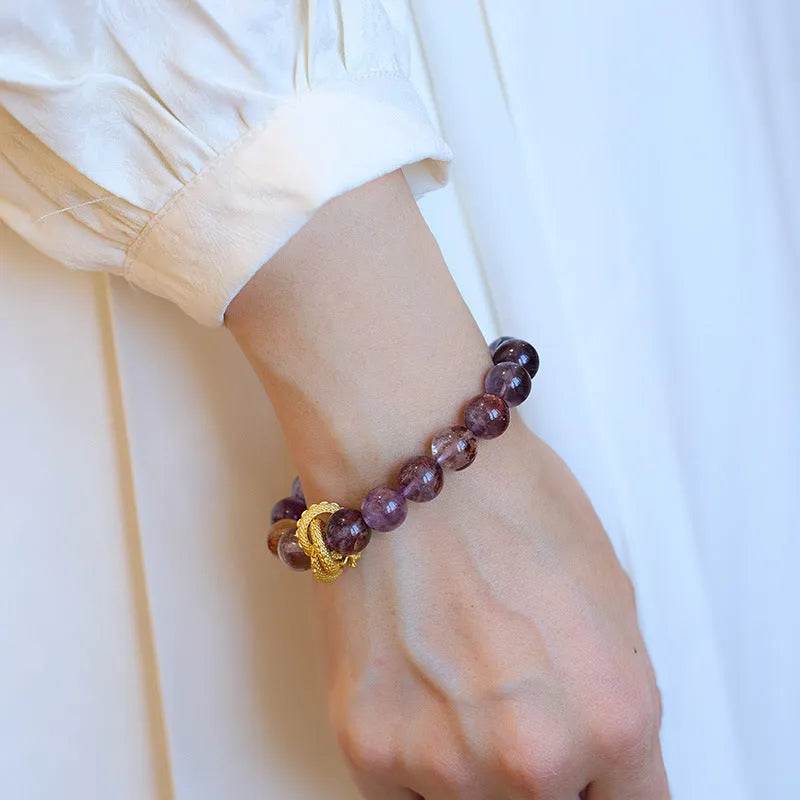Purple ghost crystal bracelet with nine purple symbols and zodiac animal motifs measuring 10mm wide