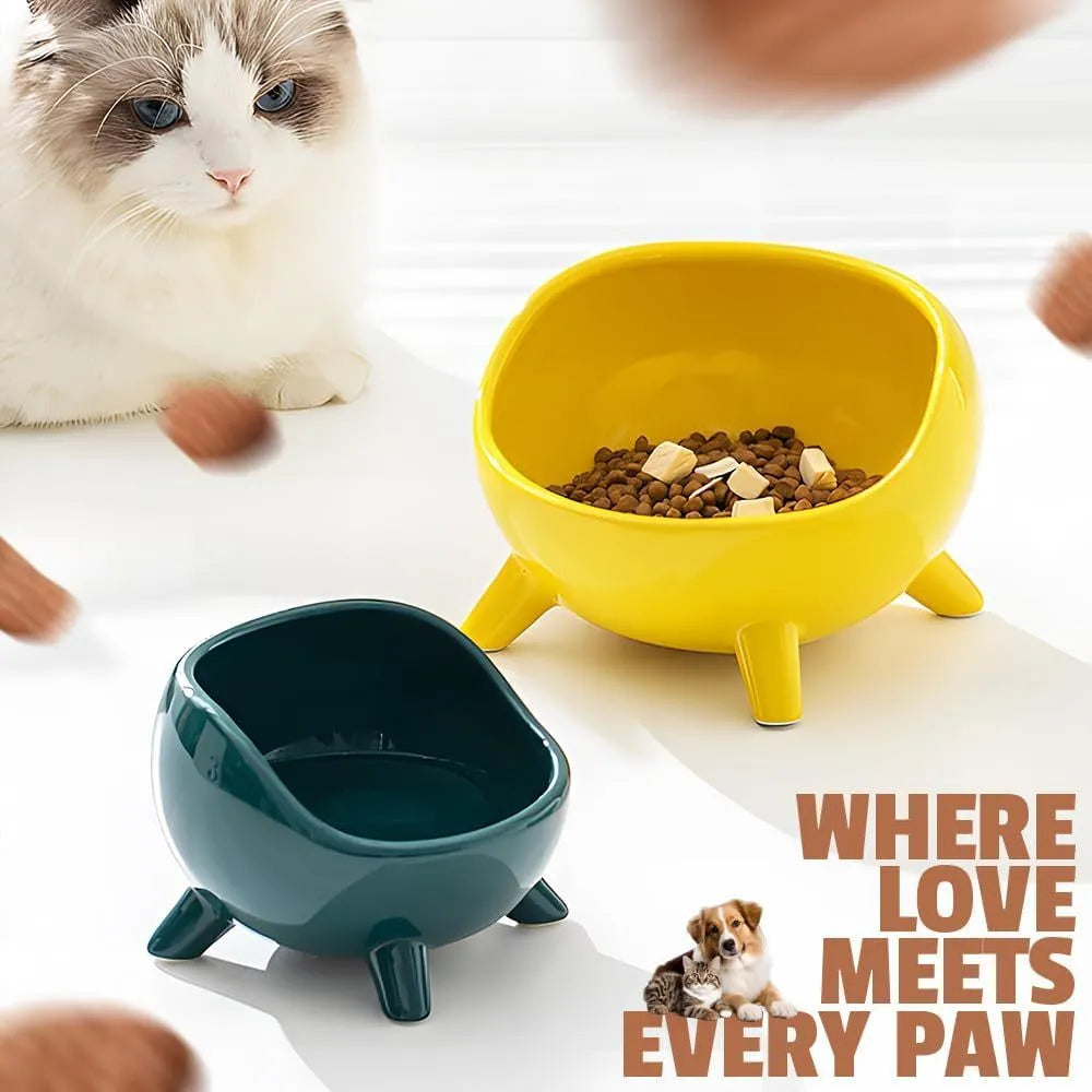 Green ceramic pet bowl with four legs and rounded splatter guard for cats and small dogs