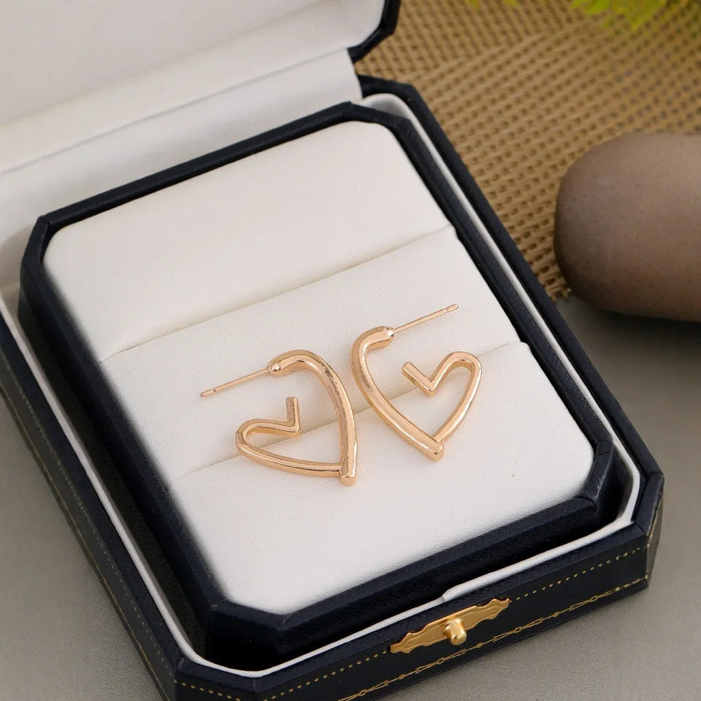 Simple cold style love earrings for women in gold colour metal stud earrings