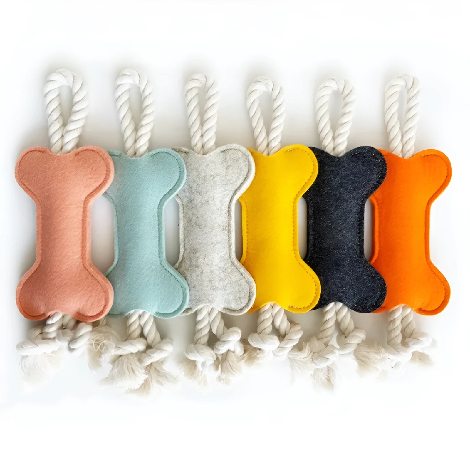 Bone shaped dog rope toy with felt exterior in four colour options