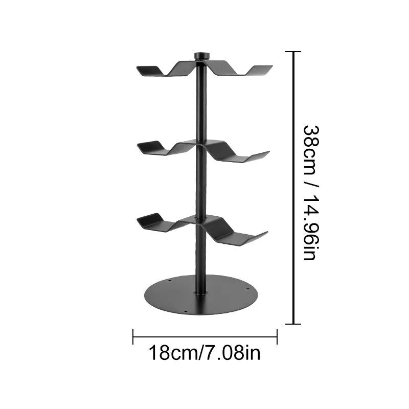 Black two-layer metal headphone bracket holding gaming headsets on a desk