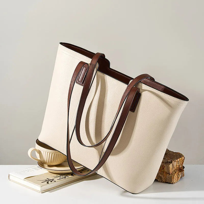 Women's black genuine leather commuter bag with multiple internal compartments in horizontal square shape