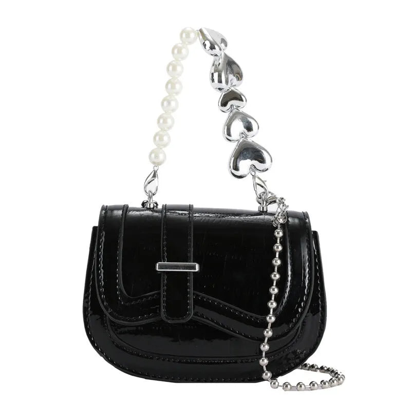 Laser pearl tote saddle girl mini crossbody bag in a horizontal square shape, shown in silver colour.