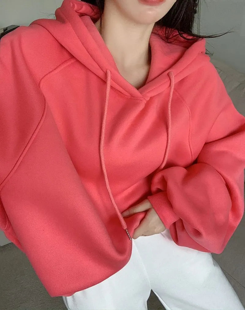 Women's loose watermelon red hooded sweater made from mulberry silk, shown sleeveless.