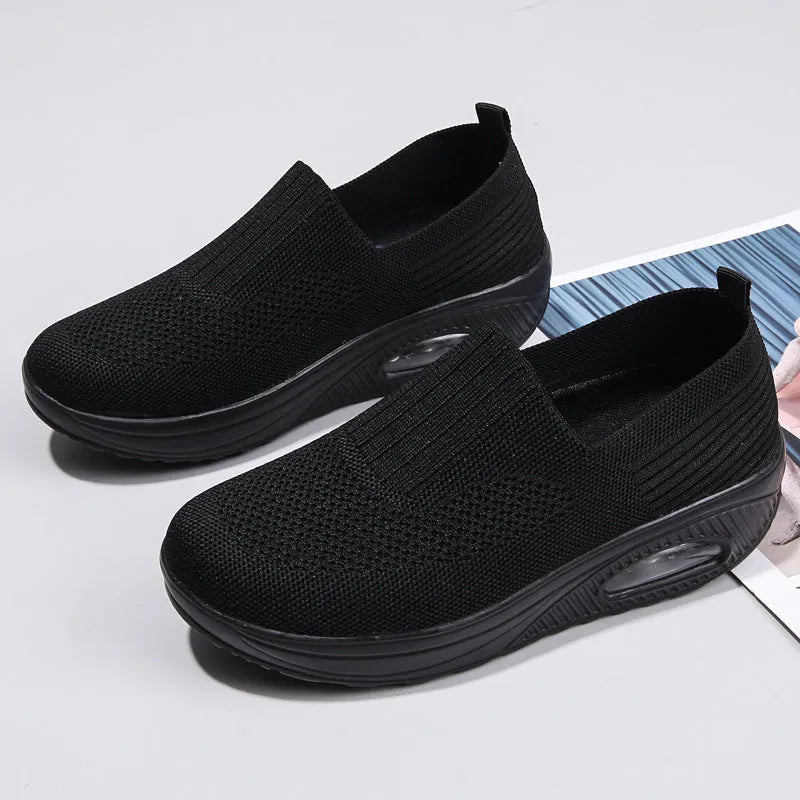 Women's mesh running shoes with air cushion in multiple colours showing round toe and mid-heel design