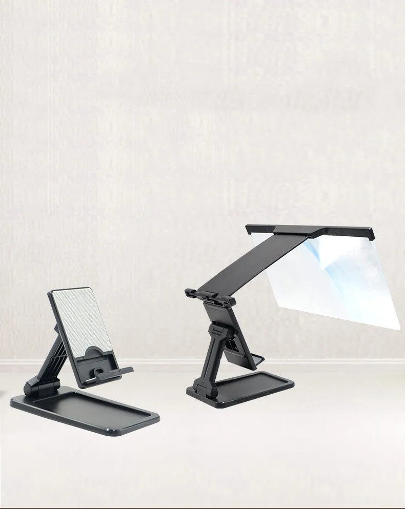 Black folding mobile phone screen amplifier with detachable holder next to an iPhone.
