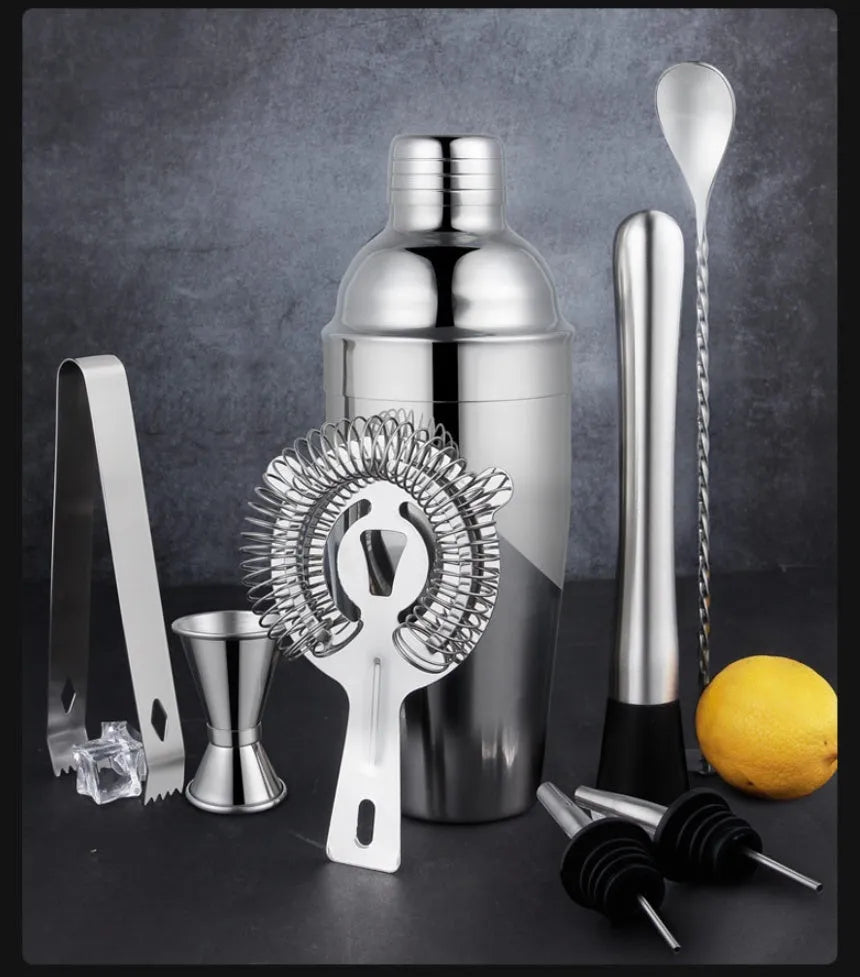23-piece stainless steel and acrylic European style cocktail set on a bar