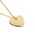 Close-up of a women's geometric heart-shaped titanium steel pendant necklace on a chain.