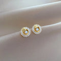 Geometric fashion jewellery set with gold plated copper detailing on titanium steel chain