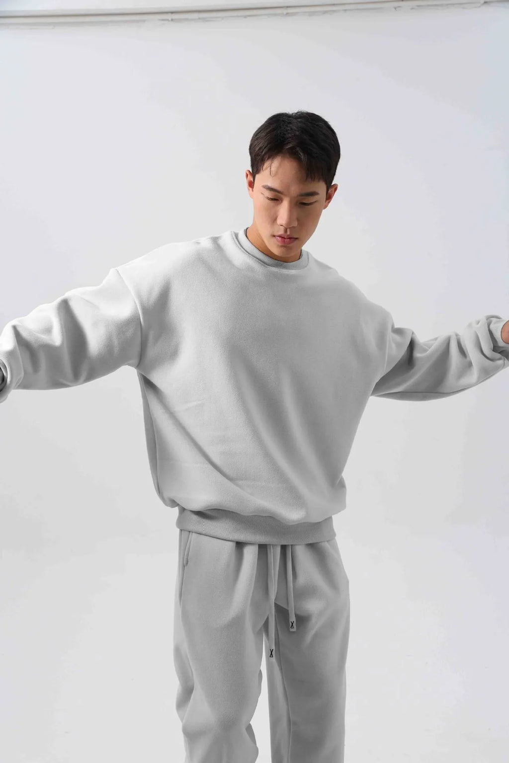 Men's polar fleece suit set showing crew neck jacket and padded trousers in five winter colour options
