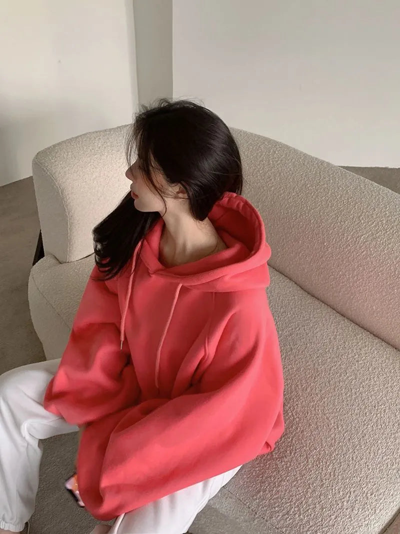 Women's loose watermelon red hooded sweater made from mulberry silk, shown sleeveless.
