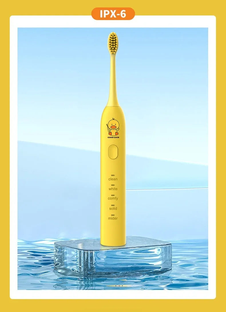 Yellow USB rechargeable electric toothbrush with small duck design and soft bristles