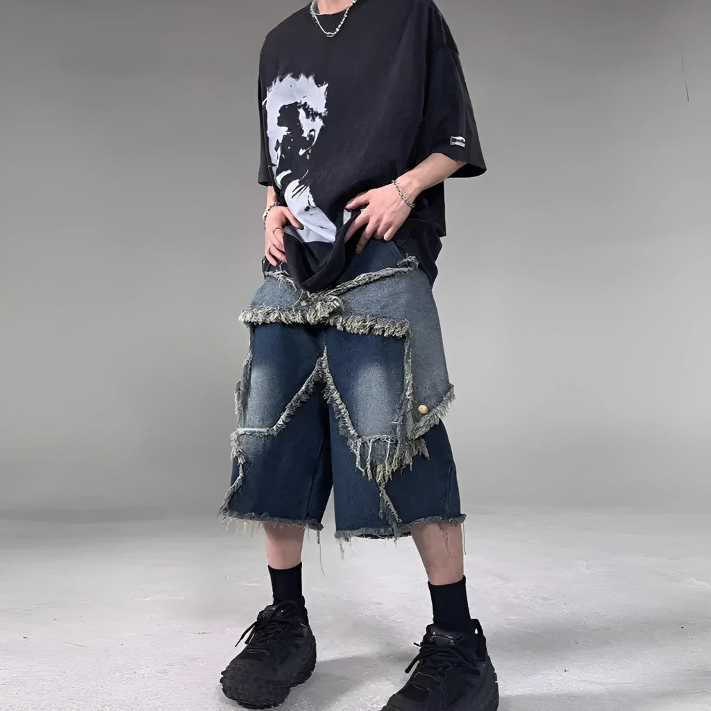 Blue denim shorts with distressed five-pointed star detailing and frayed hem, loose fit retro style