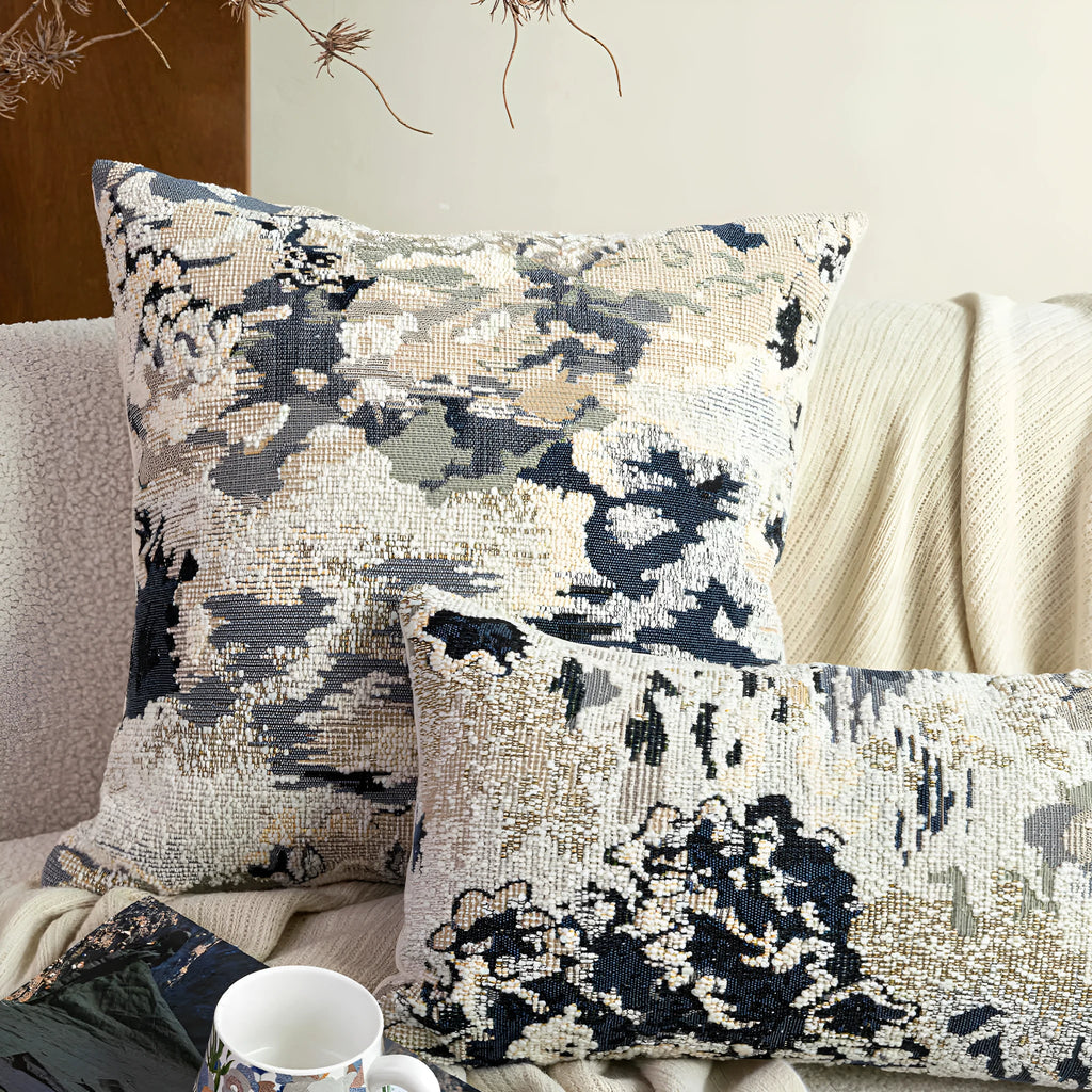 Antique blue decorative pillow with abstract flower pattern, shown in square and waist pillow sizes.
