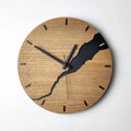 Modern wooden wall clock with a creative crack effect finish on its face, showing a silent second hand.