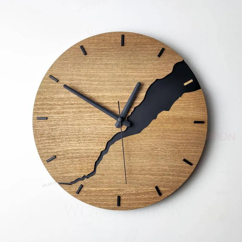 Modern wooden wall clock with a creative crack effect finish on its face, showing a silent second hand.