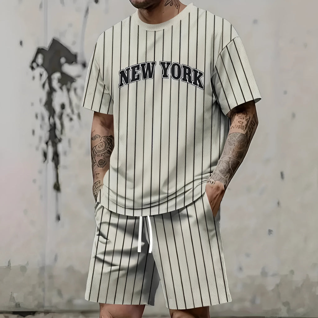 Men's grey sports suit with 3D printed letter design on short sleeve top and matching shorts