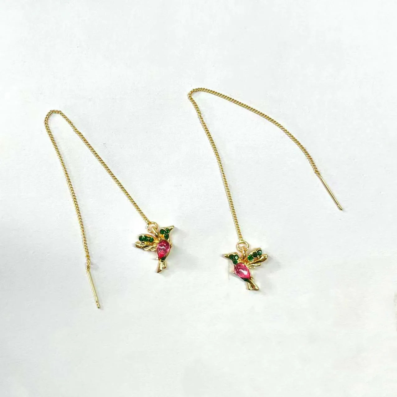 Women's long bird hanging earrings in alloy with blue electroplated finish.