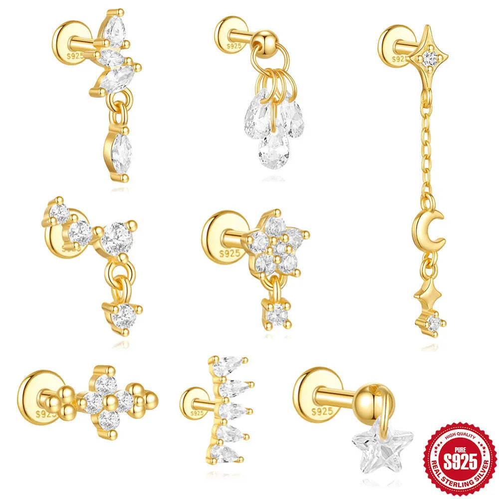 S925 sterling silver geometric moon and star drop earrings with diamond accents on a gold tone.