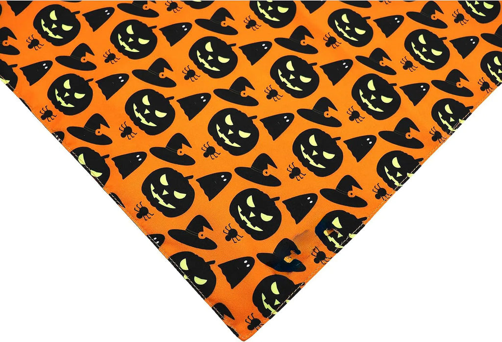 Reversible Halloween dog bandana with pumpkin and spider web patterns in black and orange