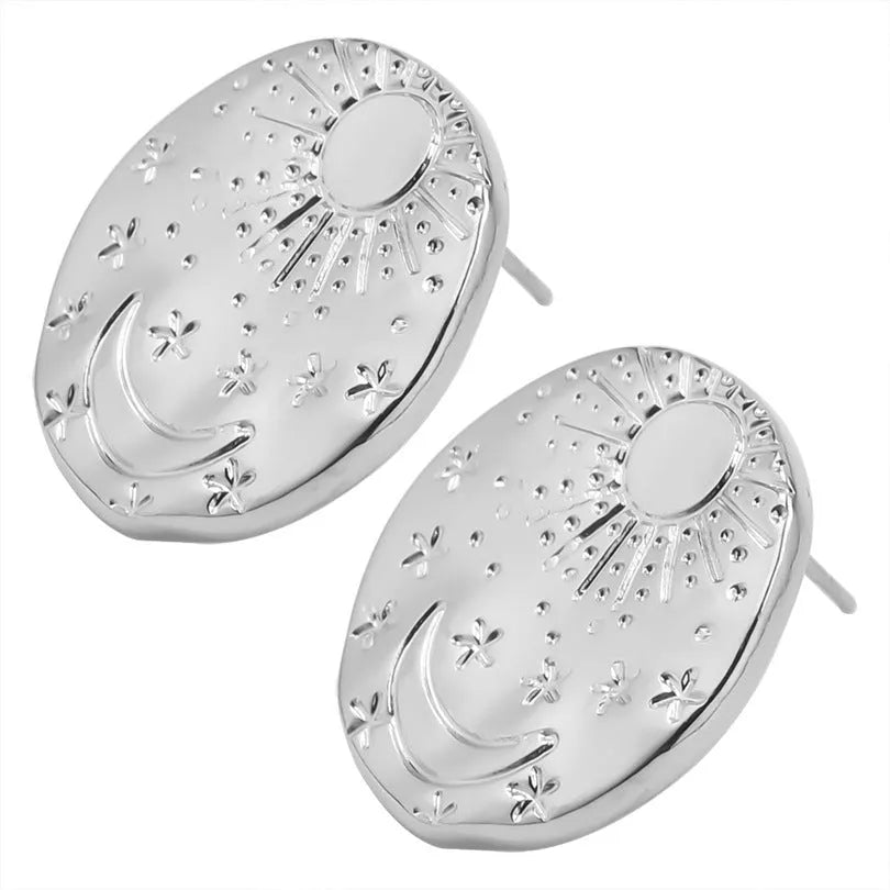 A pair of geometric shell design stud earrings in stainless steel with a gold electroplated finish.