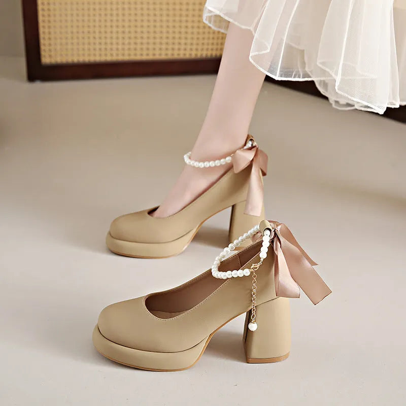 Women's beige Mary Jane shoes with chunky heel and ankle strap buckle showing round toe design