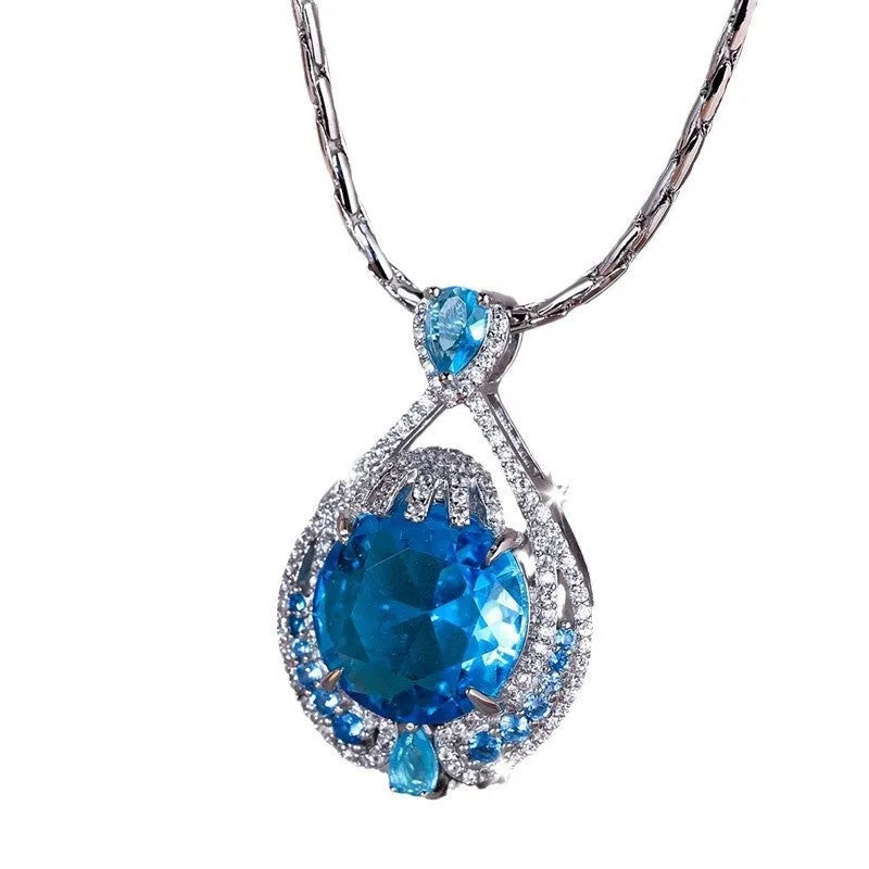 Geometric pendant necklace with blue fireworks cut gemstones on water wave chain