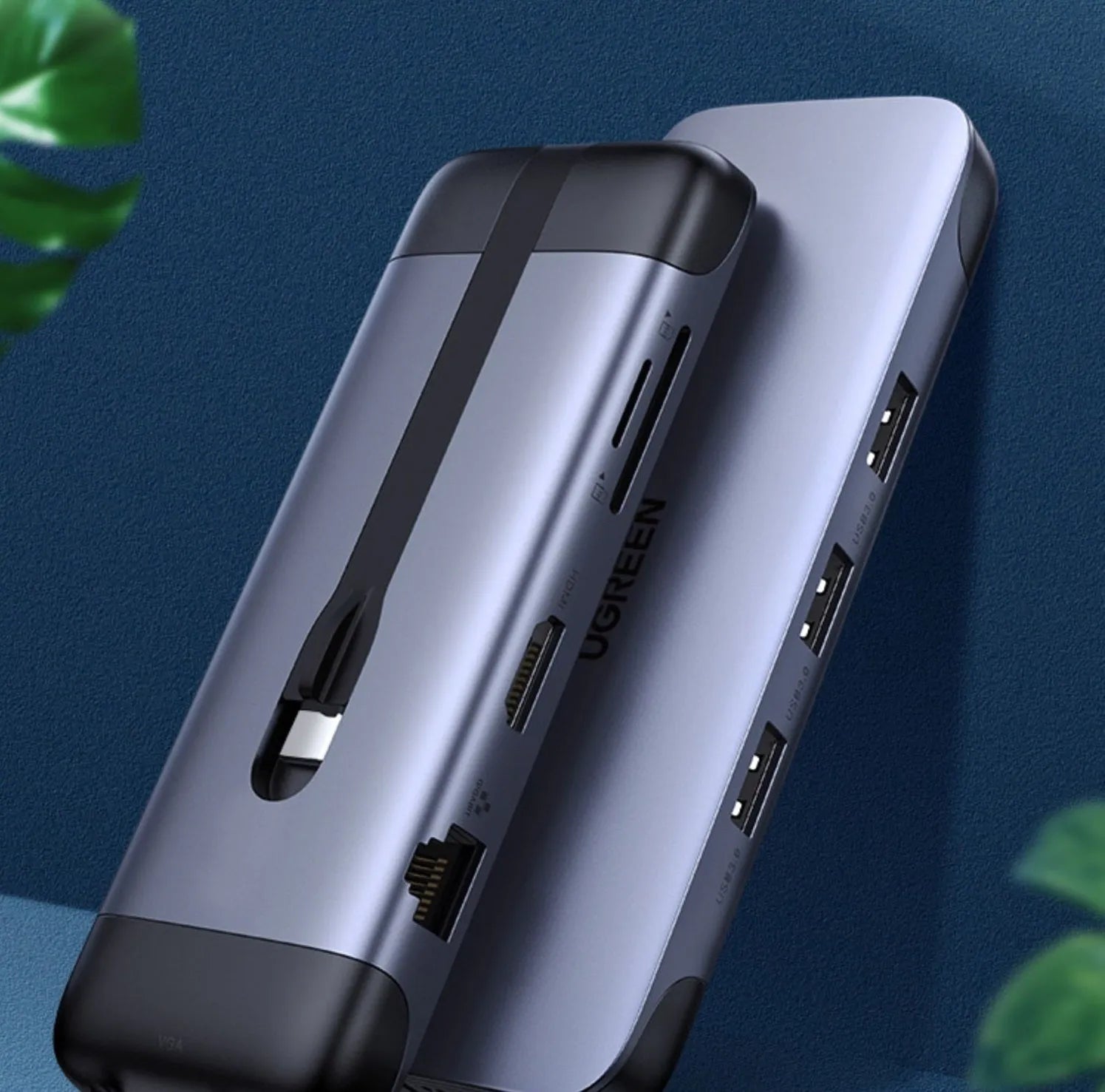 USB-C expansion dock adapter with short cable, showing HDMI, USB 3.0, and Power Delivery ports.