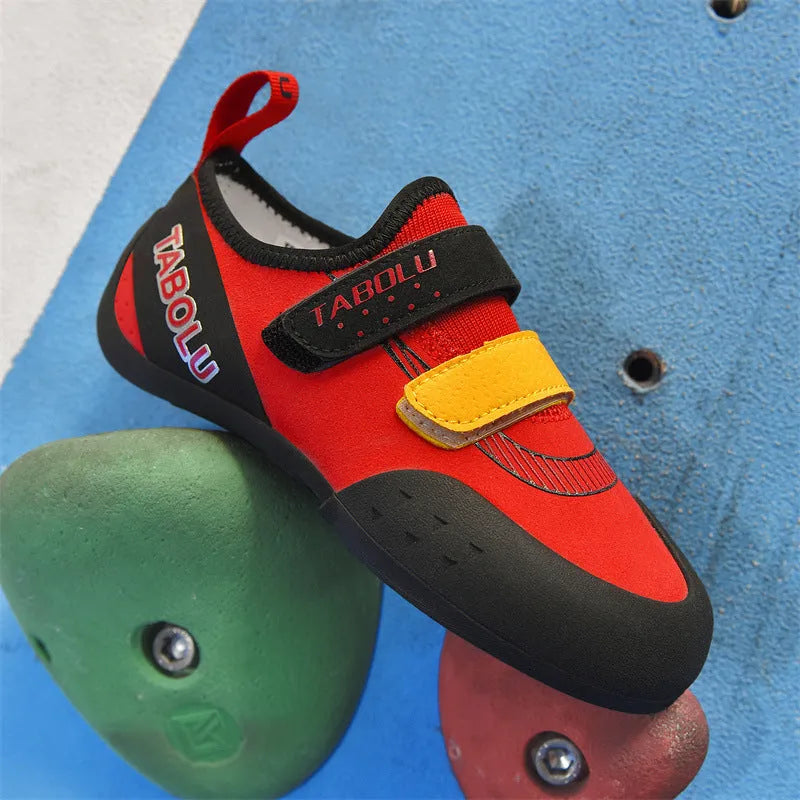 Beginner rock climbing shoes with Velcro fastening in black with red, orange yellow, or pink accents