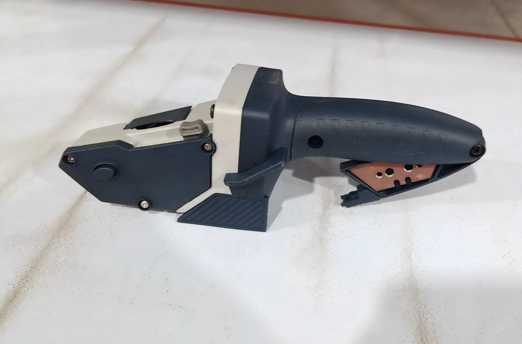 Blue aluminium alloy woodworking cutter with TPR plastic handle and measurement scale.