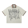 Men's loose asymmetric short-sleeved top with graffiti print on lapel in blue or red.