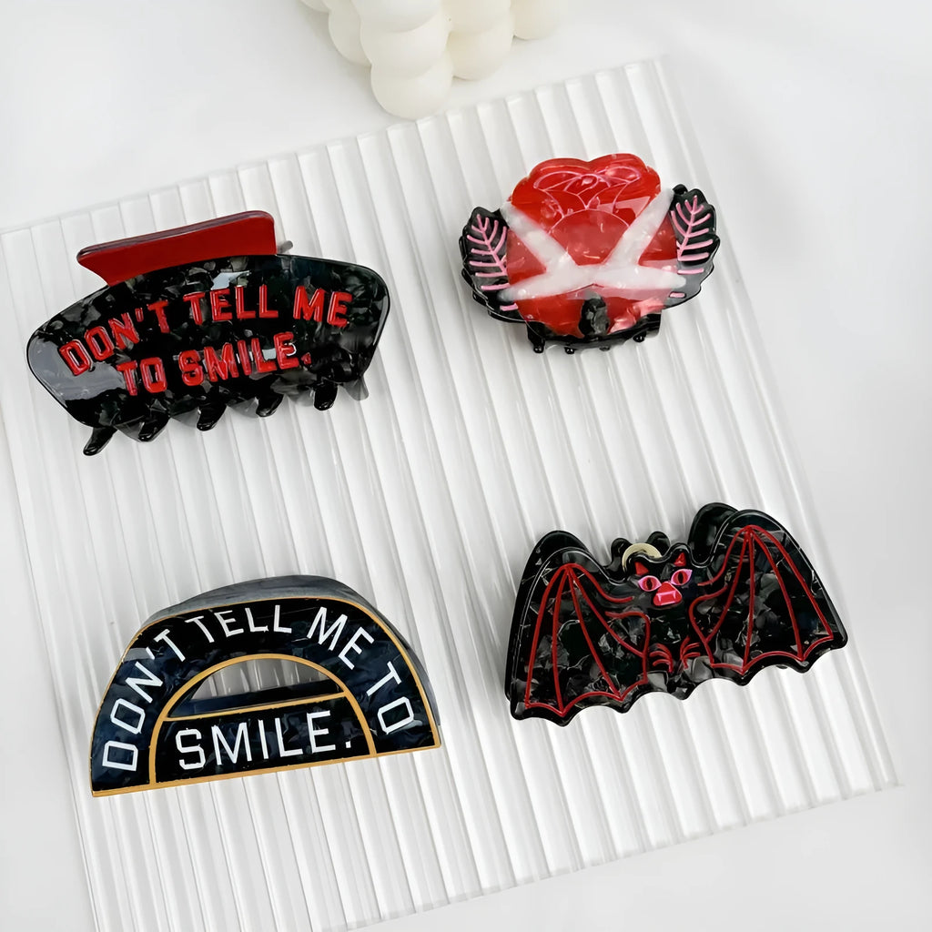 Halloween shark vinegar bat hair clip with bat design elements in four colour options